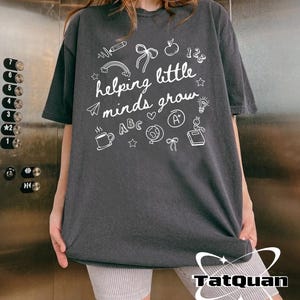 HELPING LITTLE MINDS GROW TEE